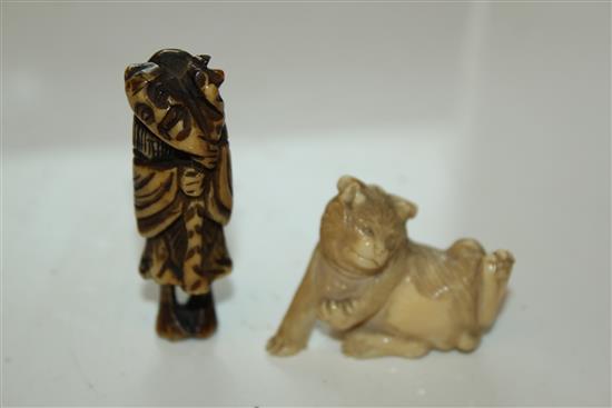 A Japanese ivory figure of a cat and a stag horn netsuke, 5.8cm